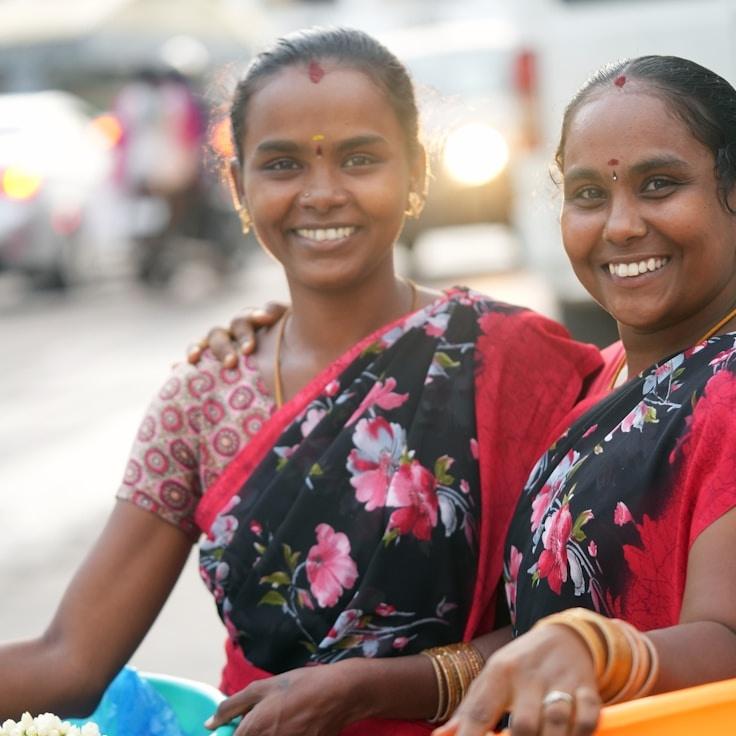 Aria Malik, Lead Design Curator at Willow Frame Haven, reviewing corporate floral arrangements